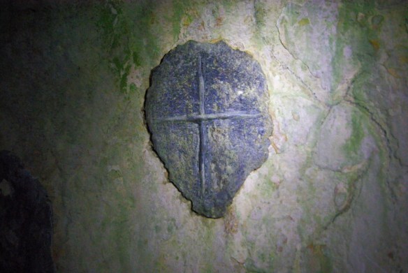 ancient cross carved inside the hermits cave- 7th C