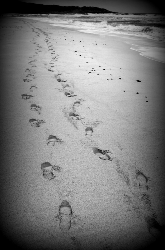 footprints on snady beach